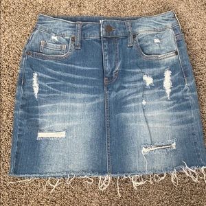 Distressed denim mini skirt